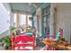 Inviting porch featuring colorful seating, decorative columns, and a serene outdoor space at 78 Society St, Charleston, SC 29401