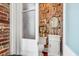 Unique powder room featuring patterned wallpaper and stylish fixtures at 78 Society St, Charleston, SC 29401