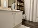 Bathroom featuring a vanity with decor, a mirror, and shelving with towels at 7870 Nummie Ct, North Charleston, SC 29418