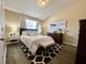 Bedroom featuring neutral decor, vaulted ceiling, patterned rug, and hardwood floors at 7870 Nummie Ct, North Charleston, SC 29418