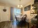 Cozy dining area with a table set for four, with access to outdoor space at 7870 Nummie Ct, North Charleston, SC 29418