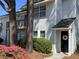 Charming two-story home with a manicured lawn and welcoming front door at 7870 Nummie Ct, North Charleston, SC 29418