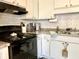 Well-equipped kitchen with white cabinets and subway tile backsplash, perfect for culinary enthusiasts at 7870 Nummie Ct, North Charleston, SC 29418