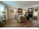 Comfortable living room with a stone fireplace and modern decor at 7870 Nummie Ct, North Charleston, SC 29418
