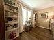 Bright room with stylish shelving, wood floors, and plenty of natural light at 7870 Nummie Ct, North Charleston, SC 29418