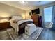 Cozy bedroom featuring a queen bed, nightstands, dresser, television, and decorative rug at 7870 Nummie Ct, North Charleston, SC 29418