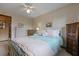 Guest bedroom featuring a metal frame bed and floral wallpaper at 8147 Waltham Rd, North Charleston, SC 29406