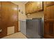 Convenient laundry room with modern washer and dryer, cabinet storage, and easy access to outside at 8147 Waltham Rd, North Charleston, SC 29406
