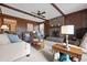 Cozy living room with a brick fireplace, wood paneled walls, and comfortable seating at 8147 Waltham Rd, North Charleston, SC 29406