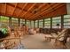 Comfortable sun room with lots of seating and windows to let in natural light at 8147 Waltham Rd, North Charleston, SC 29406