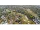 Scenic aerial view of a golf course with lush greenery and mature trees surrounding beautiful homes at 816 Club Cottage Rd, Edisto Beach, SC 29438