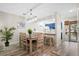 Bright dining area with a table for six, adjacent to the updated kitchen at 816 Club Cottage Rd, Edisto Beach, SC 29438