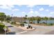 Scenic community entrance with Wyndham sign, flags, mature landscaping, and views of the water at 816 Club Cottage Rd, Edisto Beach, SC 29438