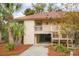 Inviting home with a covered carport, cozy balcony, and meticulously maintained landscaping at 816 Club Cottage Rd, Edisto Beach, SC 29438