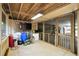 Screened garage area with a television, mini fridge, and lots of space for storage, entertainment, or a workshop at 816 Club Cottage Rd, Edisto Beach, SC 29438