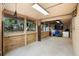 Versatile garage space with natural light, exterior views, and potential for conversion into workshop or storage area at 816 Club Cottage Rd, Edisto Beach, SC 29438