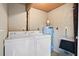 Functional laundry room equipped with washer, dryer, water heater, and additional storage space for household needs at 816 Club Cottage Rd, Edisto Beach, SC 29438