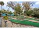 Scenic miniature golf course winding through lush landscaping and charming water features at 816 Club Cottage Rd, Edisto Beach, SC 29438