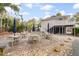 Inviting patio with tables and umbrellas, perfect for outdoor dining and relaxation at 816 Club Cottage Rd, Edisto Beach, SC 29438