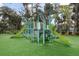 Fun and safe playground area with slides, climbing structures, and soft turf for to enjoy at 816 Club Cottage Rd, Edisto Beach, SC 29438