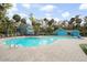 Relaxing community pool featuring cool blue water, ample seating, and a charming poolside bar for refreshments at 816 Club Cottage Rd, Edisto Beach, SC 29438