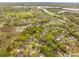 Aerial view of a residential neighborhood with lush greenery and waterfront access at 85 Colleton Dr, Charleston, SC 29407