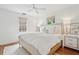Bright bedroom features a cozy bed with soft linens, two windows, and matching nightstands at 85 Colleton Dr, Charleston, SC 29407