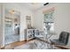 Bright dining room with a glass table, comfortable gray chairs, and a decorative woven wall hanging at 85 Colleton Dr, Charleston, SC 29407