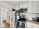 Modern kitchen featuring stainless steel appliances, white cabinets, and butcher block countertops at 85 Colleton Dr, Charleston, SC 29407