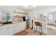Bright kitchen with white cabinets, stainless steel refrigerator, and butcher block countertops at 85 Colleton Dr, Charleston, SC 29407