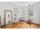Bright home office features natural light, hardwood floors, and stylish furniture for a productive workspace at 85 Colleton Dr, Charleston, SC 29407