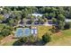An aerial view showcasing the community pool, tennis courts, pickleball and parking at 8618 Mcchune Ct, North Charleston, SC 29420