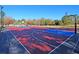 Outdoor basketball court featuring red, white, and blue painted playing surfaces at 8618 Mcchune Ct, North Charleston, SC 29420