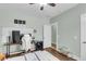 Modern bedroom with hardwood floors, fan, desk and contemporary wall art at 8618 Mcchune Ct, North Charleston, SC 29420