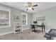 Inviting bedroom features lots of natural light, and a desk; perfect for a home office at 8618 Mcchune Ct, North Charleston, SC 29420