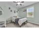 Comfortable bedroom with a ceiling fan, bright window and playful decor at 8618 Mcchune Ct, North Charleston, SC 29420