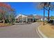 The community clubhouse with a covered entry, well-maintained landscaping, and ample parking space at 8618 Mcchune Ct, North Charleston, SC 29420