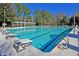 Inviting community pool with diving boards, clean blue water, and clear lane markers for swimming laps at 8618 Mcchune Ct, North Charleston, SC 29420