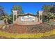 Community entrance sign with brick accents and colorful landscaping at 8618 Mcchune Ct, North Charleston, SC 29420