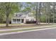 Inviting home featuring a covered porch and beautiful landscaping at 8618 Mcchune Ct, North Charleston, SC 29420