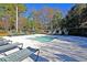 Community kiddie pool with shallow clear water and lounge chairs for parents to relax nearby at 8618 Mcchune Ct, North Charleston, SC 29420