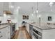 Well-lit kitchen with stainless steel appliances, granite countertops, and a view to the living area at 8618 Mcchune Ct, North Charleston, SC 29420