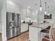 Bright kitchen features stainless steel appliances, granite counters, and white cabinetry at 8618 Mcchune Ct, North Charleston, SC 29420
