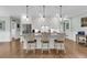 Bright kitchen features stainless steel appliances, granite counters, and an island with bar stool seating at 8618 Mcchune Ct, North Charleston, SC 29420