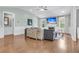 Bright living room with fireplace, hardwood floors, and large windows for ample natural light at 8618 Mcchune Ct, North Charleston, SC 29420