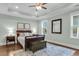 Spacious main bedroom with tray ceiling, hardwood floors and neutral color palette at 8618 Mcchune Ct, North Charleston, SC 29420
