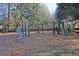 Community playground area with various climbing structures, slides, and a soft wood chip ground cover at 8618 Mcchune Ct, North Charleston, SC 29420