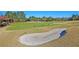 Well-maintained golf course with a sand trap in the foreground at 8618 Mcchune Ct, North Charleston, SC 29420