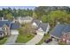 A stunning aerial shot of a residential home featuring a driveway and well-maintained lawn at 9447 Harroway Rd, Summerville, SC 29485