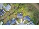 Aerial view of a home in a cul-de-sac, featuring a large backyard and mature trees at 9447 Harroway Rd, Summerville, SC 29485